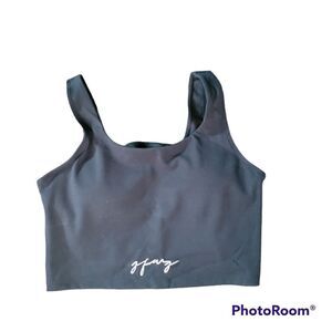 Black sports bra with padded cups, shelf and criss-cross back